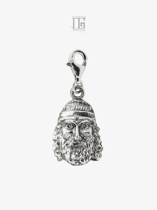 Silver charm depicting the face of the Riace Bronze A Cod. MGK 3704 V-60
