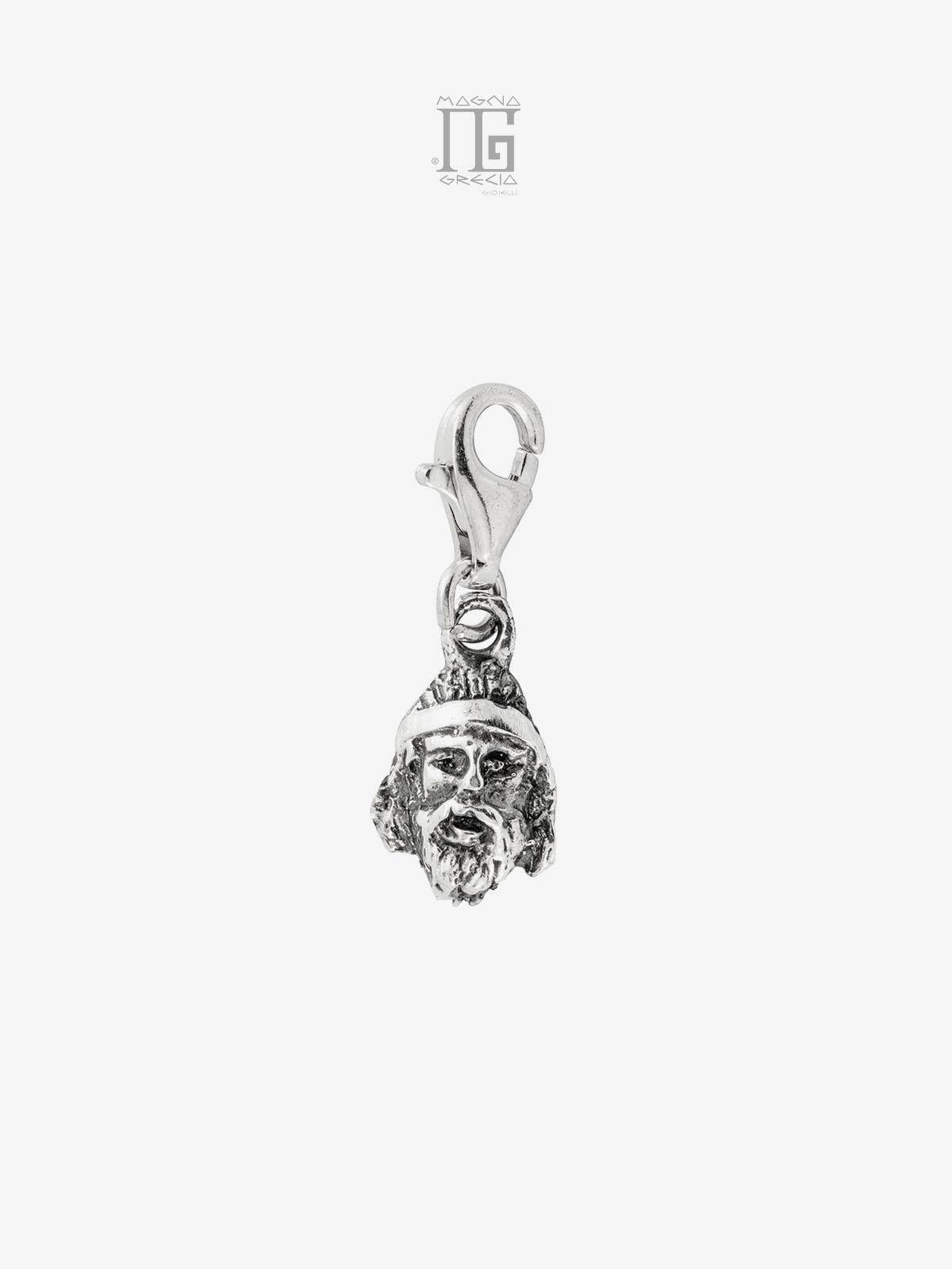 Silver charm depicting the face of the Riace Bronze A Cod. MGK 3704 V-63